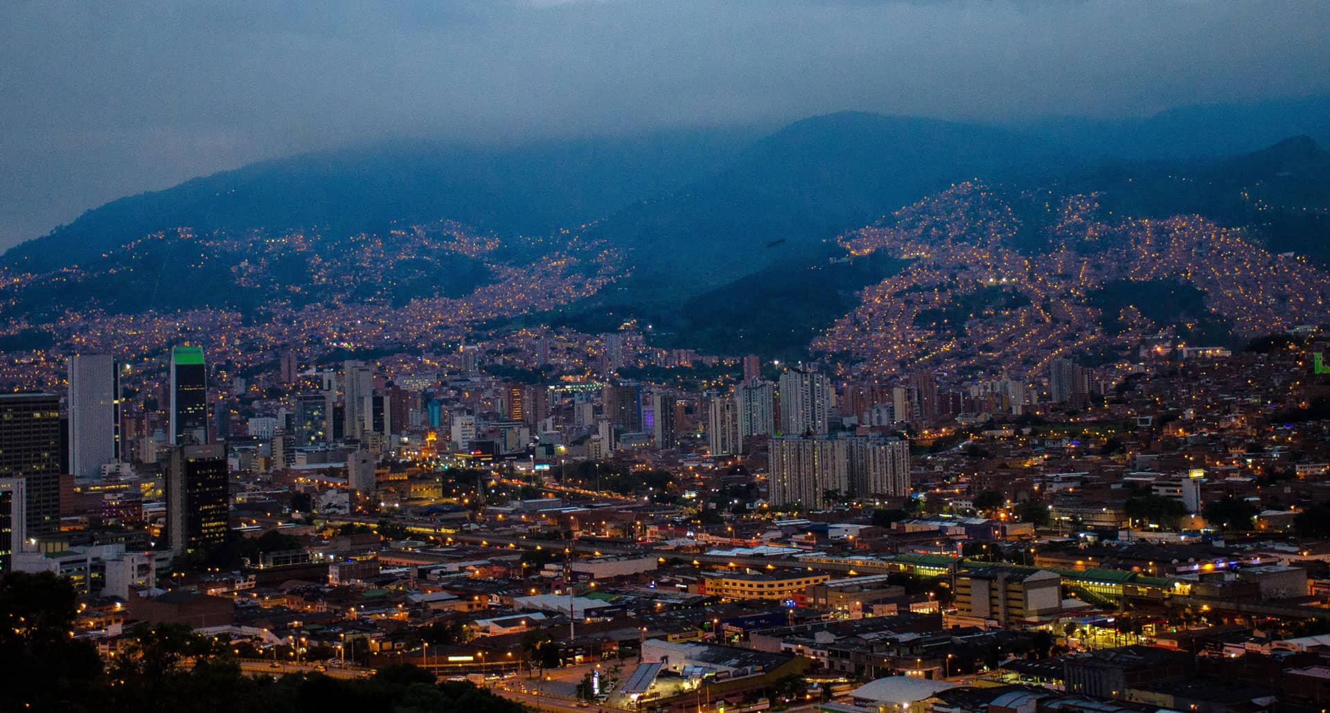 Aerial shot of the Medellin, Columbia skyline with mountains in background.